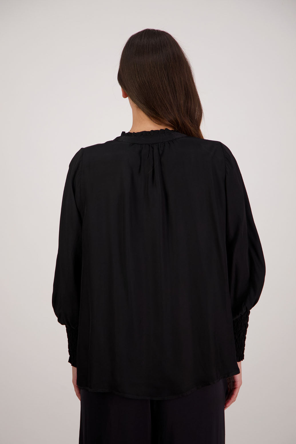 Bestseller. Audrey Shirt in Black by Briarwood NZ. 100% viscose shirt with full length sleeves, ruffle around neck, button through, shirred wrists