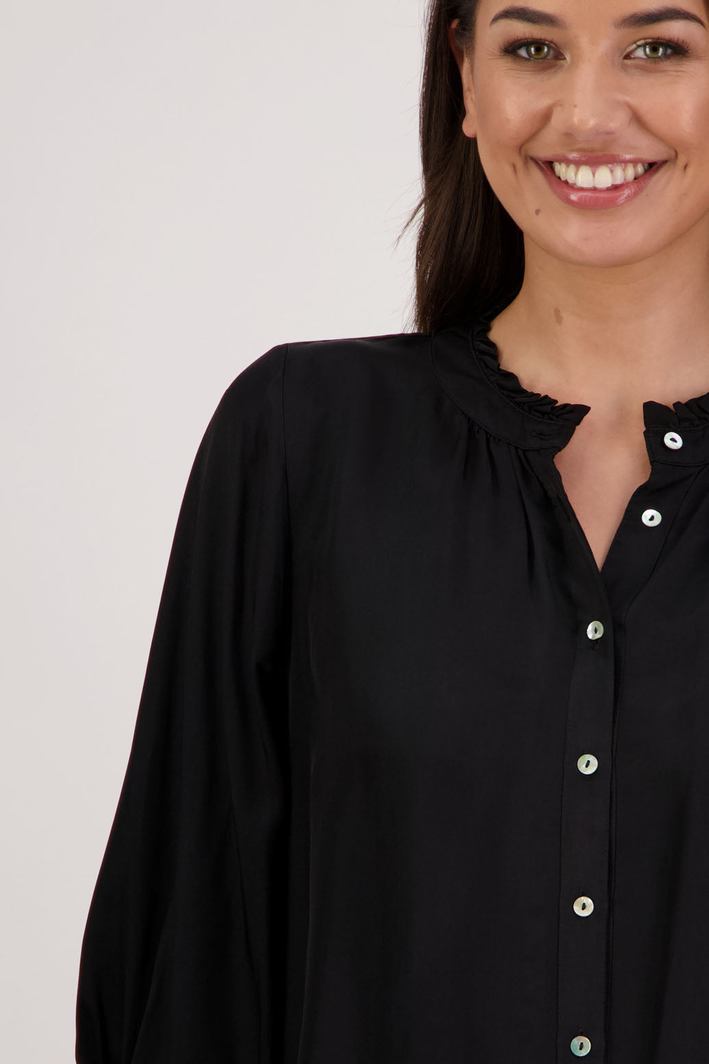 Bestseller. Audrey Shirt in Black by Briarwood NZ. 100% viscose shirt with full length sleeves, ruffle around neck, button through, shirred wrists