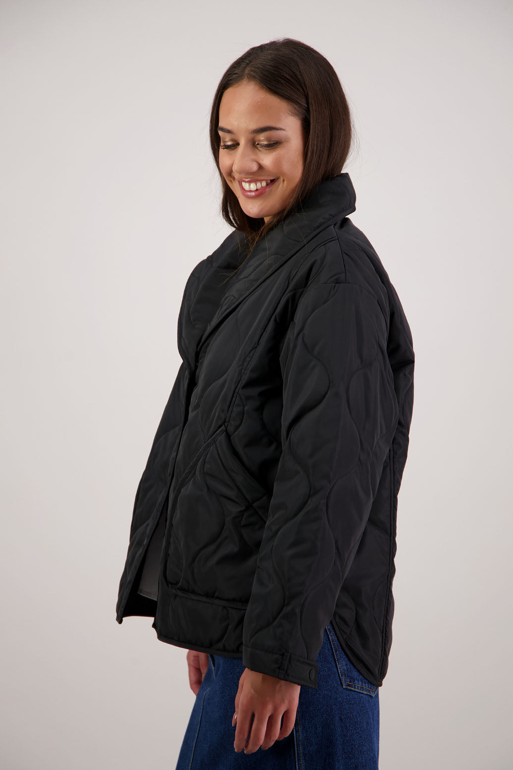 BESTSELLER. Chapman Quilted Jacket in Black by Briarwood NZ. High collar, side split detail, buttons front, stitched on pockets, slightly longer in the back, box fit, lined