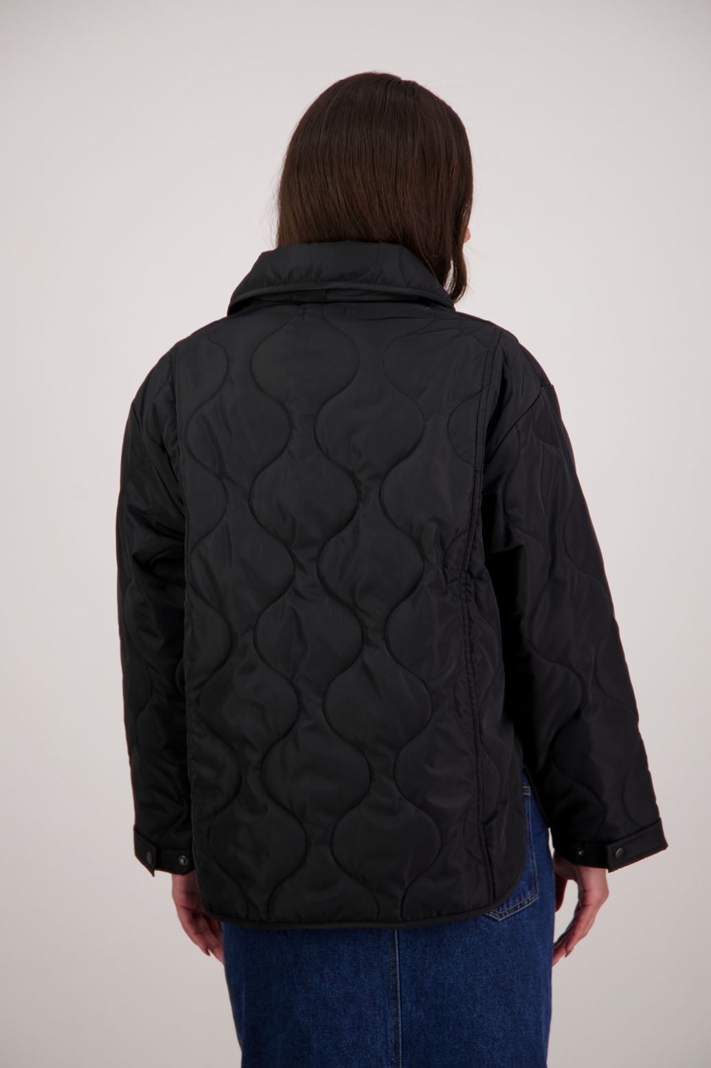 BESTSELLER. Chapman Quilted Jacket in Black by Briarwood NZ. High collar, side split detail, buttons front, stitched on pockets, slightly longer in the back, box fit, lined