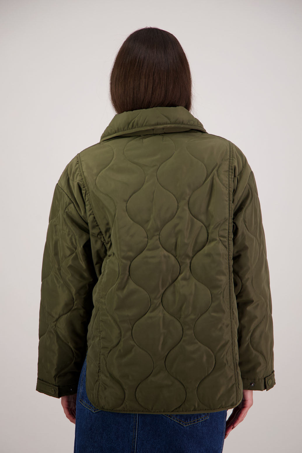 BESTSELLER. Chapman Quilted Jacket in Khaki by Briarwood NZ. Quilted swirl design, high collar, side split detail, buttons front, stitched on pockets, slightly longer in the back, box fit, lined