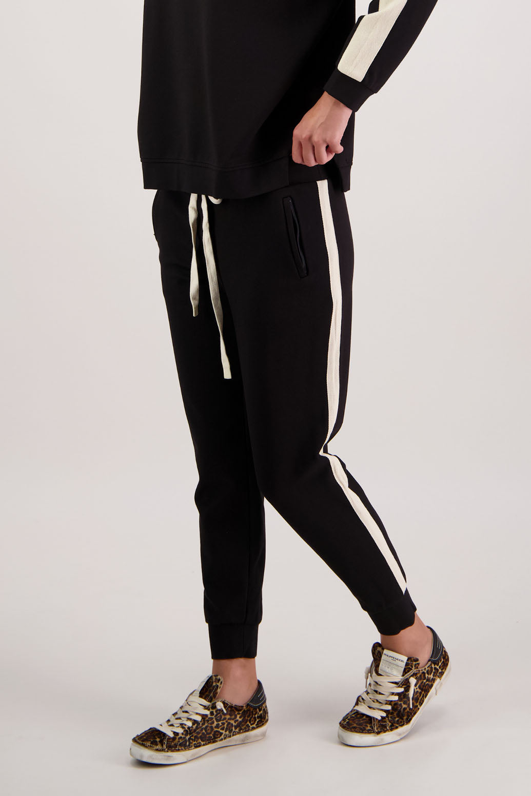 BESTSELLER. Claudia Pant by Briarwood NZ. Pont Pant with zip pockets, elastic waist with tie cord, cuffed legs and contrast side stripe.