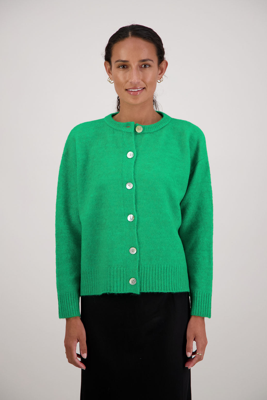 Fable Cardigan in Green by Briarwood NZ. Alpaca/Wool blend long sleeve cardigan with side splits and longer at the back