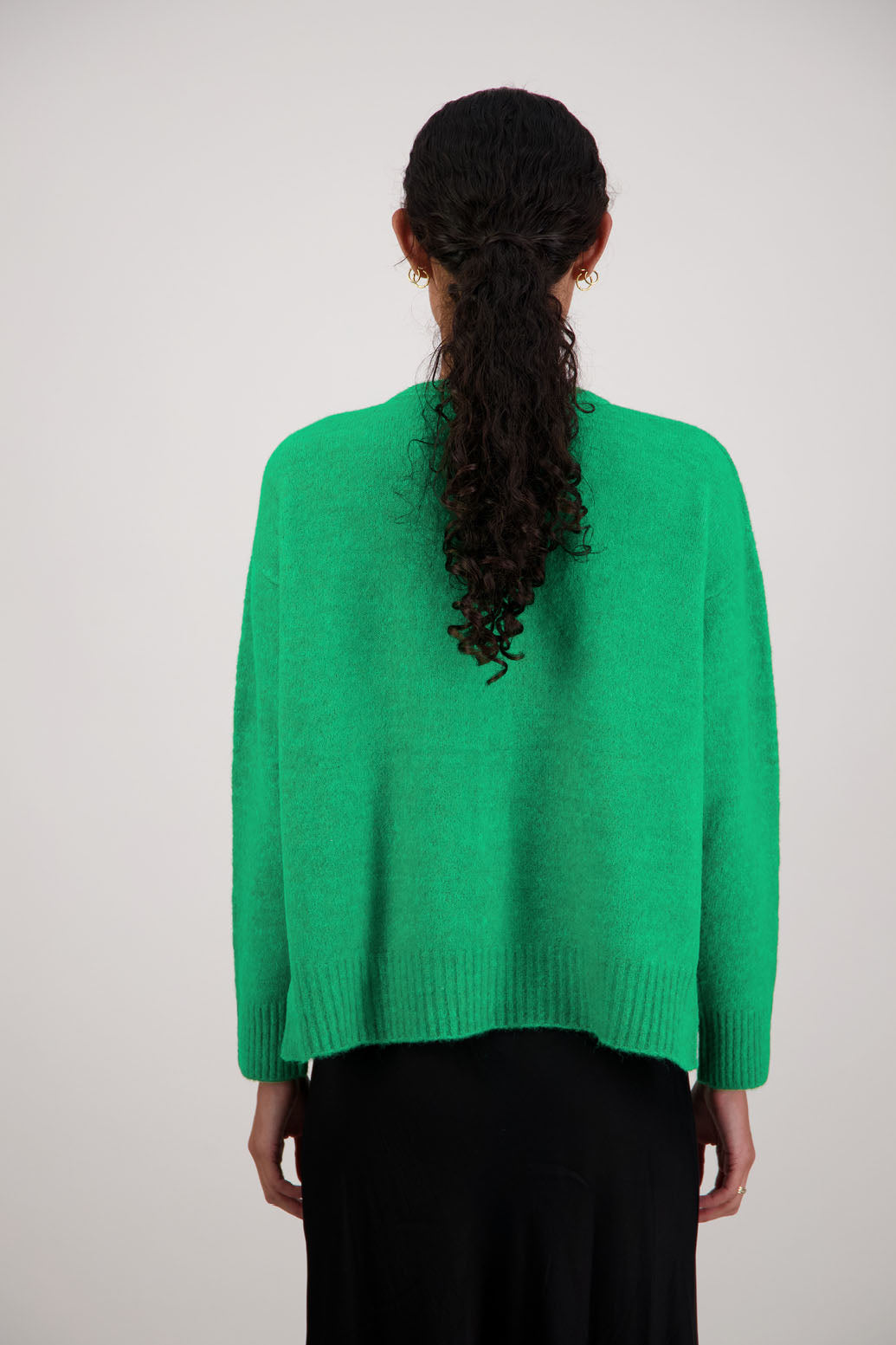 Fable Cardigan in Green by Briarwood NZ. Alpaca/Wool blend long sleeve cardigan with side splits and longer at the back