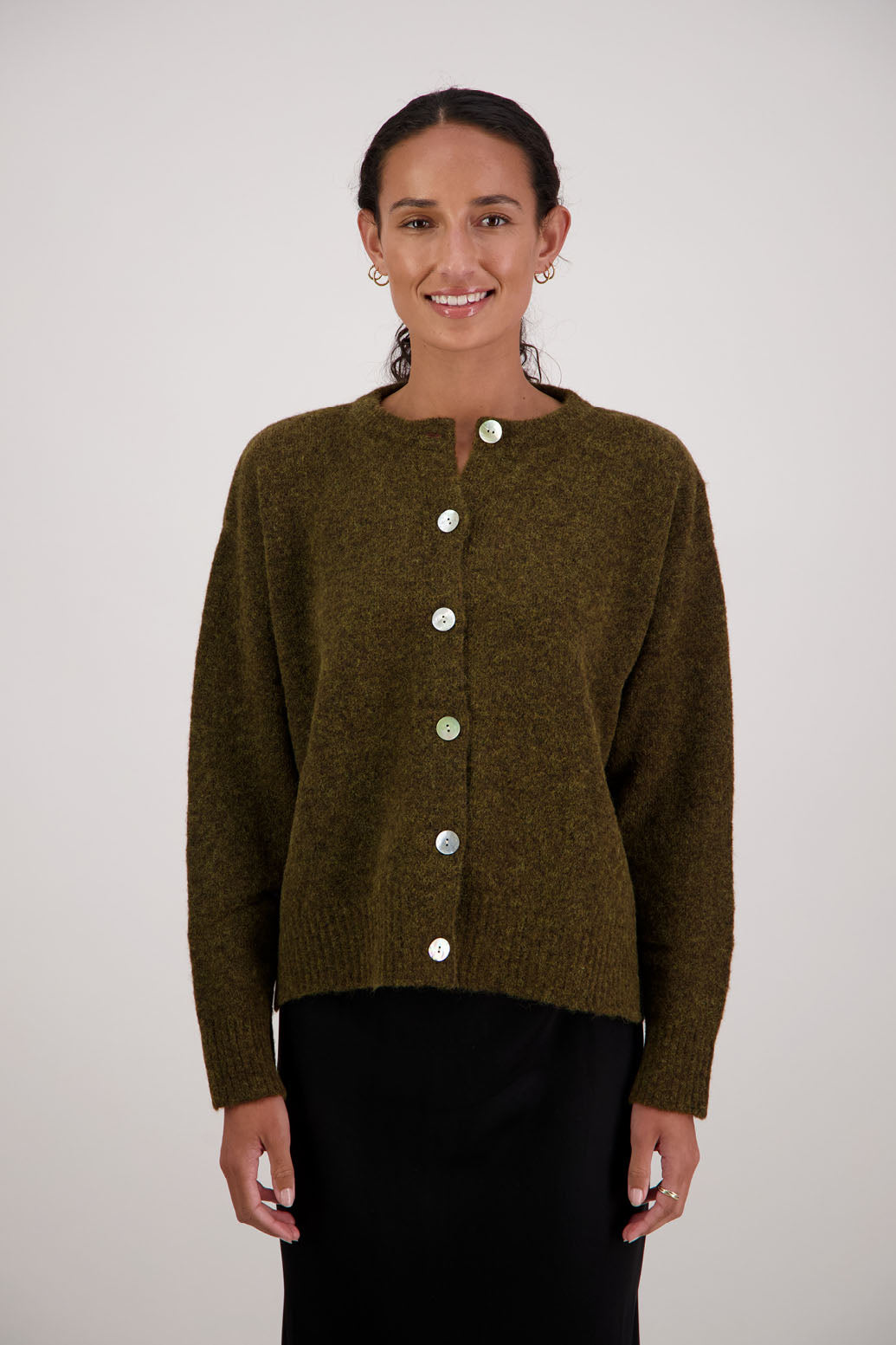 Fable Cardigan in Olive by Briarwood NZ. Alpaca/Wool blend long sleeve cardigan with side splits and longer at the back