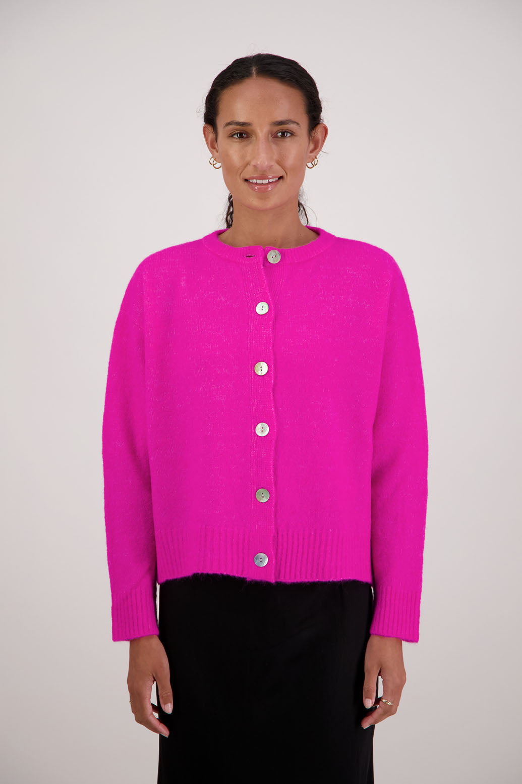 Fable Cardigan in Pink by Briarwood NZ. Alpaca/Wool blend long sleeve cardigan with side splits and longer at the back