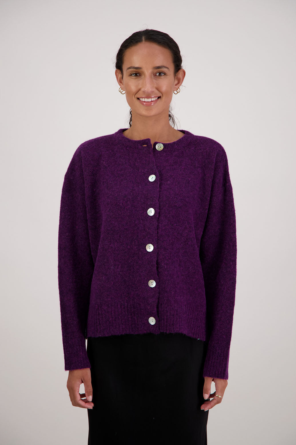 Fable Cardigan in Purple by Briarwood NZ. Alpaca/Wool blend long sleeve cardigan with side splits and longer at the back