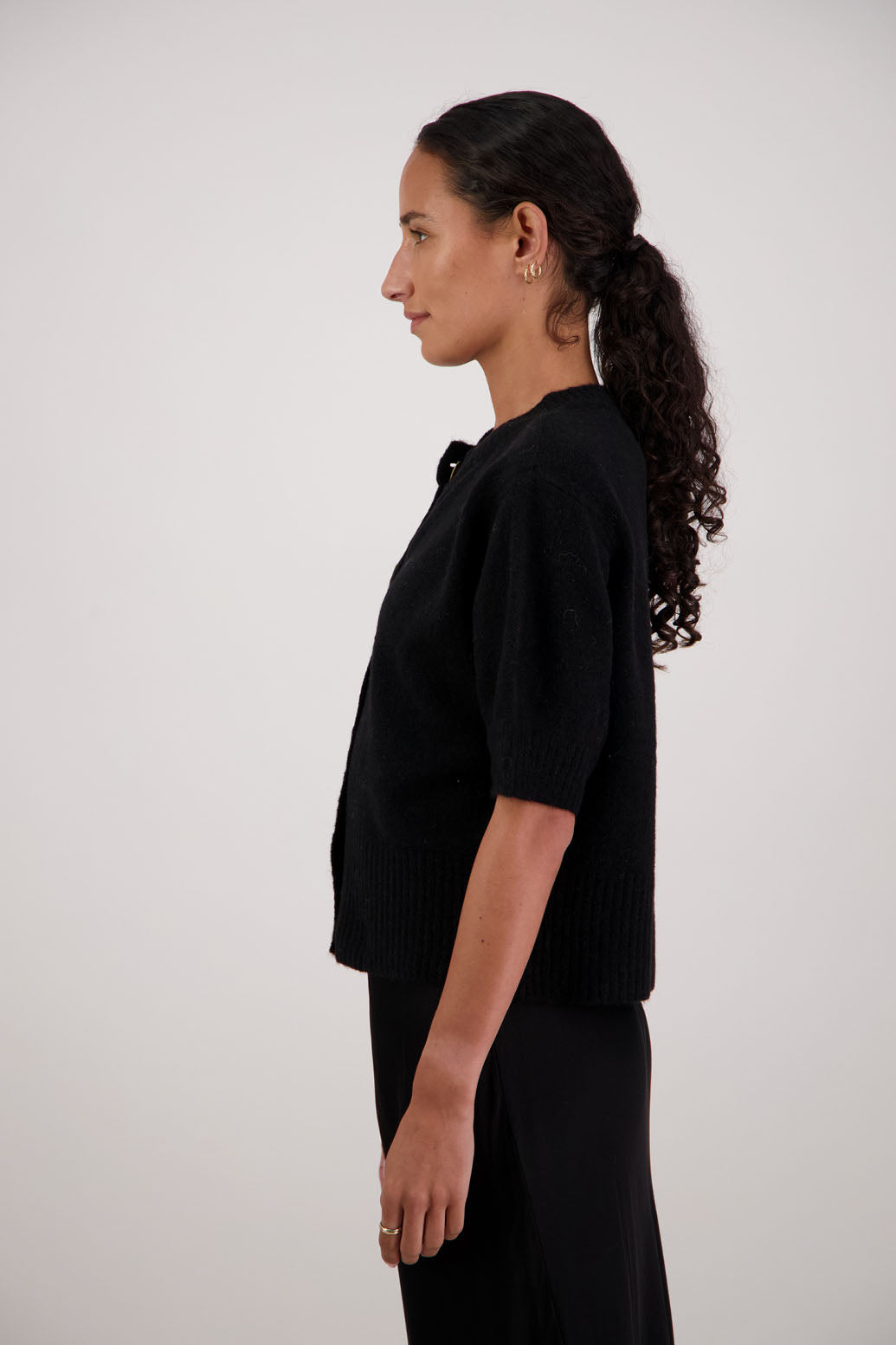 Fancy Cardigan in Black by Briarwood NZ. Alpaca/Wool blend short sleeve cardigan with buttoned front and wide waist band