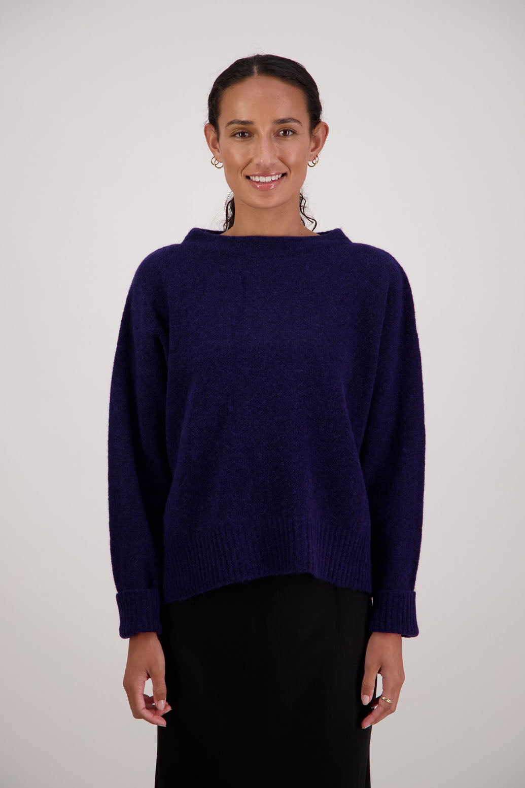 Feather Jumper in Ink by Briarwood NZ. Alpaca/Wool blend long sleeve, funnel neck jumper with side splits and longer at the back