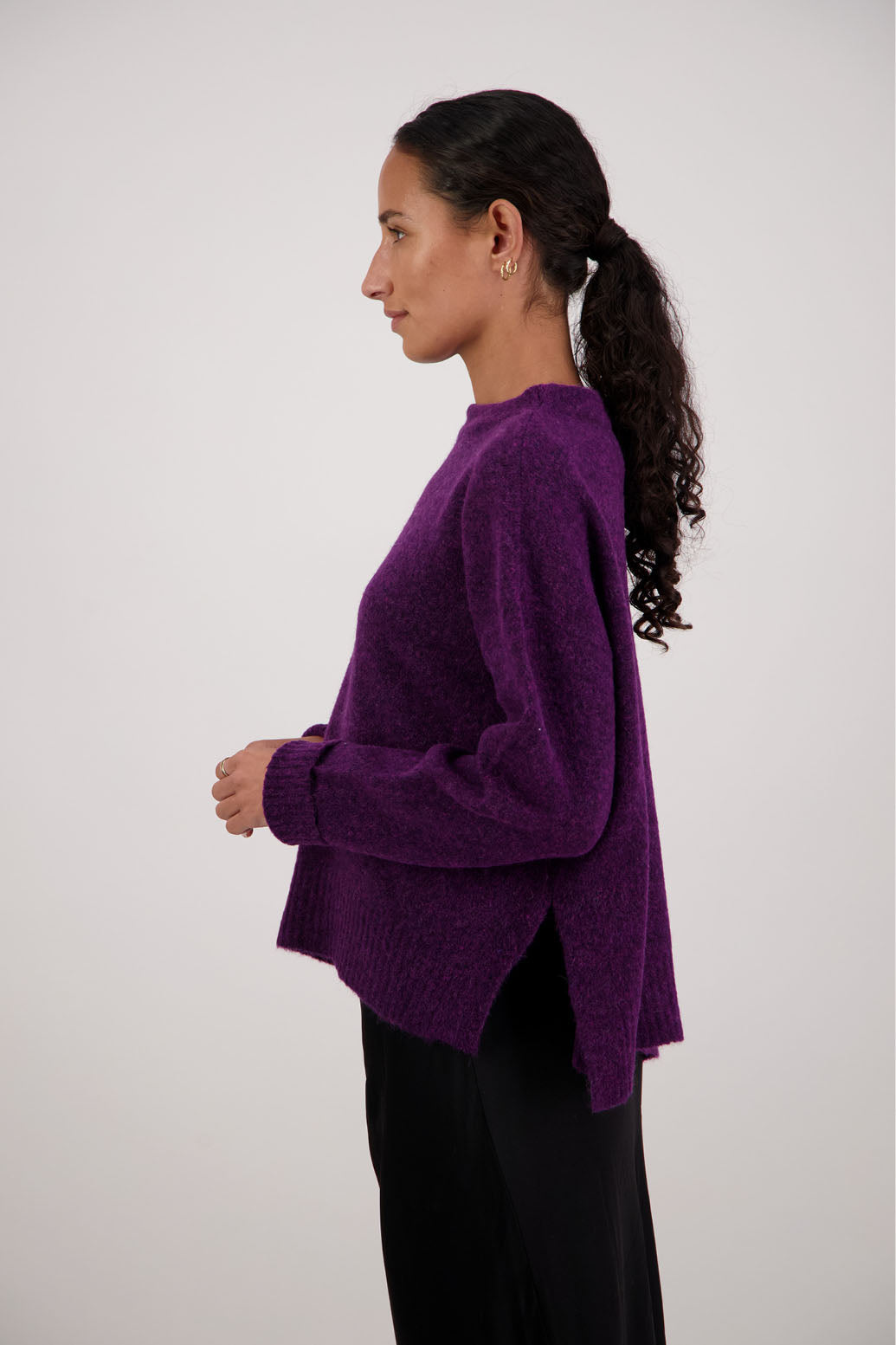 Feather Jumper in Purple by Briarwood NZ. Alpaca/Wool blend long sleeve, funnel neck jumper with side splits and longer at the back
