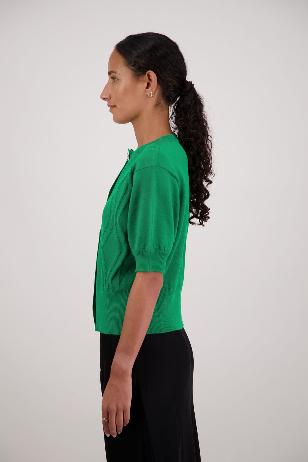 French Wool Cardigan in Emerald by Briarwood NZ. 100% Wool cardigan with short sleeves, buttoned front, wide waist band and self pattern on front