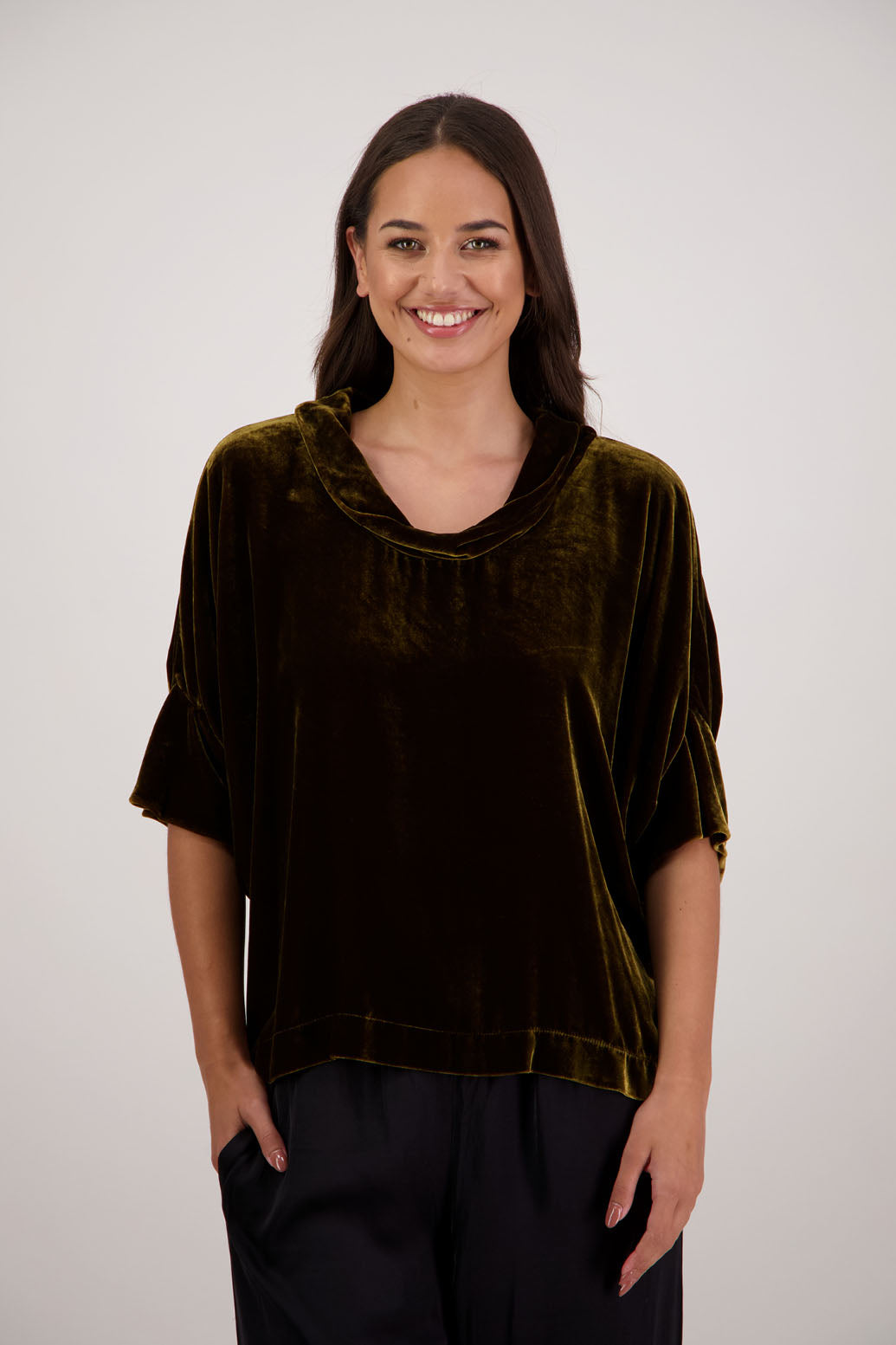 Bestseller. Hanley Top in Tan Velvet by Briarwood NZ. A
18% Silk, 82% Rayon Velvet Top with roll neck, 3/4 sleeves, split hem, loose fit, longer at the back