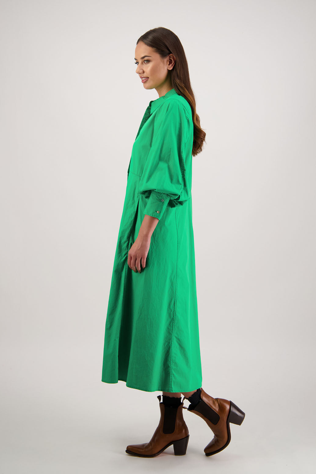 Henrietta Shirt Dress in Apple by Briarwood NZ. Made from Cotton Poplin with long full length sleeves, fitted through the body, fitted through the maxi with maxi a-line skirt, hidden button front and extended cuff with 2 buttons