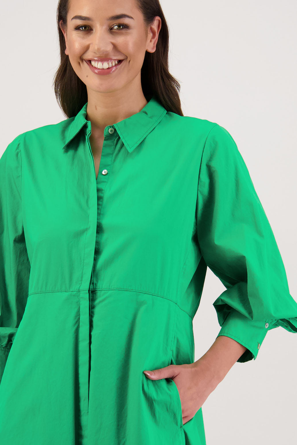 Henrietta Shirt Dress in Apple by Briarwood NZ. Made from Cotton Poplin with long full length sleeves, fitted through the body, fitted through the maxi with maxi a-line skirt, hidden button front and extended cuff with 2 buttons