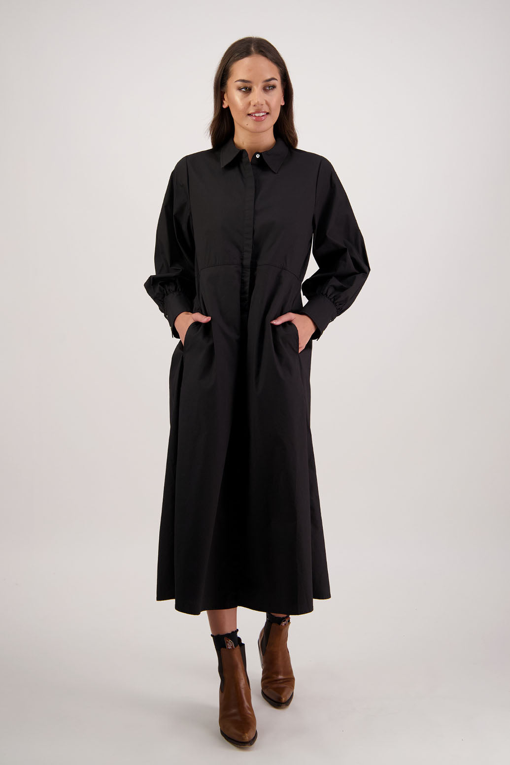 Henrietta Shirt Dress in Black by Briarwood NZ. Made from Cotton Poplin with long full length sleeves, fitted through the body, fitted through the maxi with maxi a-line skirt, hidden button front and extended cuff with 2 buttons