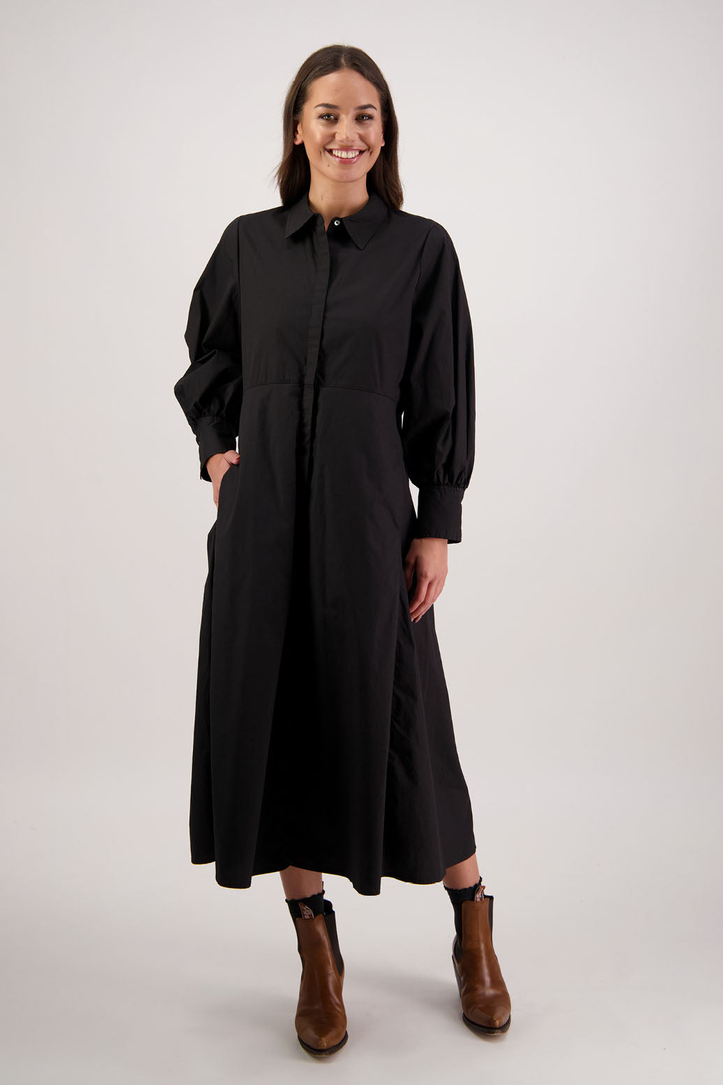 Henrietta Shirt Dress in Black by Briarwood NZ. Made from Cotton Poplin with long full length sleeves, fitted through the body, fitted through the maxi with maxi a-line skirt, hidden button front and extended cuff with 2 buttons