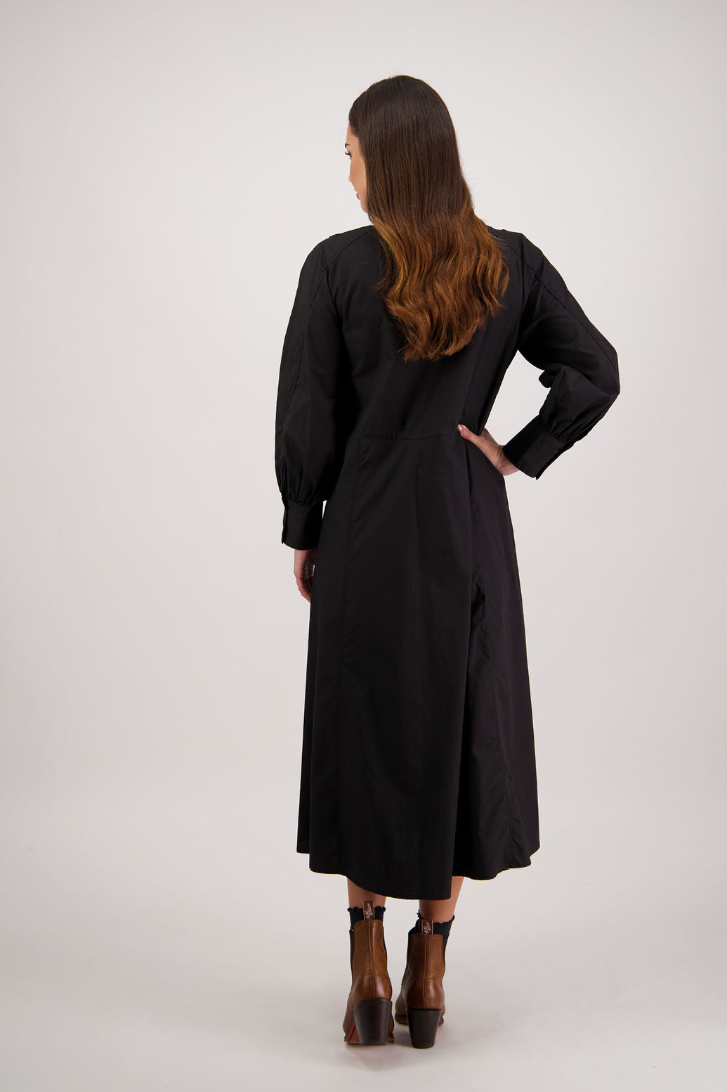 Henrietta Shirt Dress in Black by Briarwood NZ. Made from Cotton Poplin with long full length sleeves, fitted through the body, fitted through the maxi with maxi a-line skirt, hidden button front and extended cuff with 2 buttons