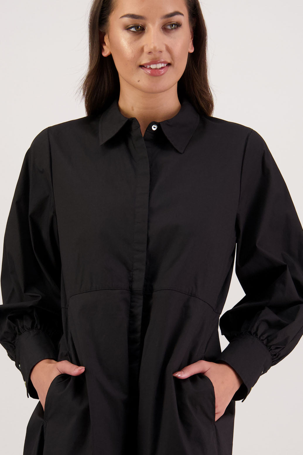 Henrietta Shirt Dress in Black by Briarwood NZ. Made from Cotton Poplin with long full length sleeves, fitted through the body, fitted through the maxi with maxi a-line skirt, hidden button front and extended cuff with 2 buttons