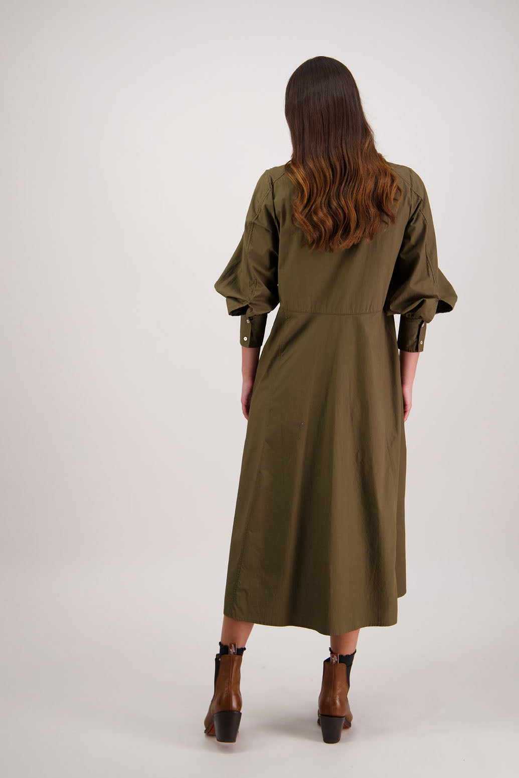 Henrietta Shirt Dress in Khaki by Briarwood NZ. Made from Cotton Poplin with long full length sleeves, fitted through the body, fitted through the maxi with maxi a-line skirt, hidden button front and extended cuff with 2 buttons