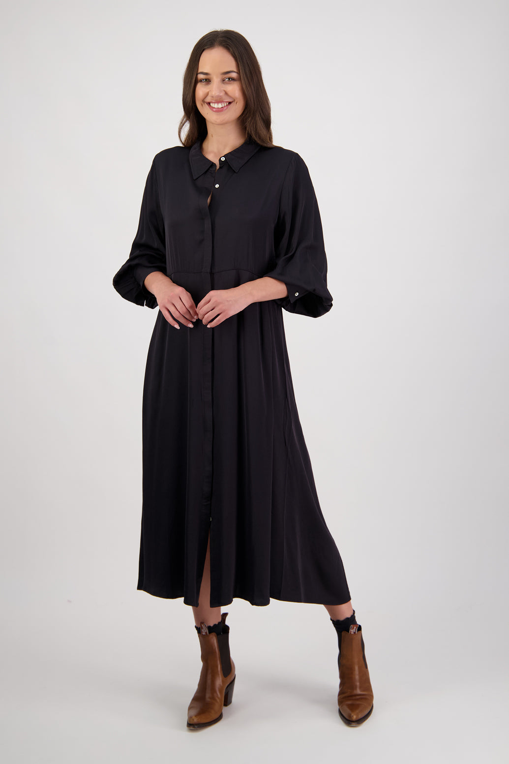 Hollie Black Shirt Dress by Briarwood NZ. 100% Viscose shirt dress with long full length sleeves, fitted through the body, A-line skirt, Hidden button down front, extended cuff with 2 button closure