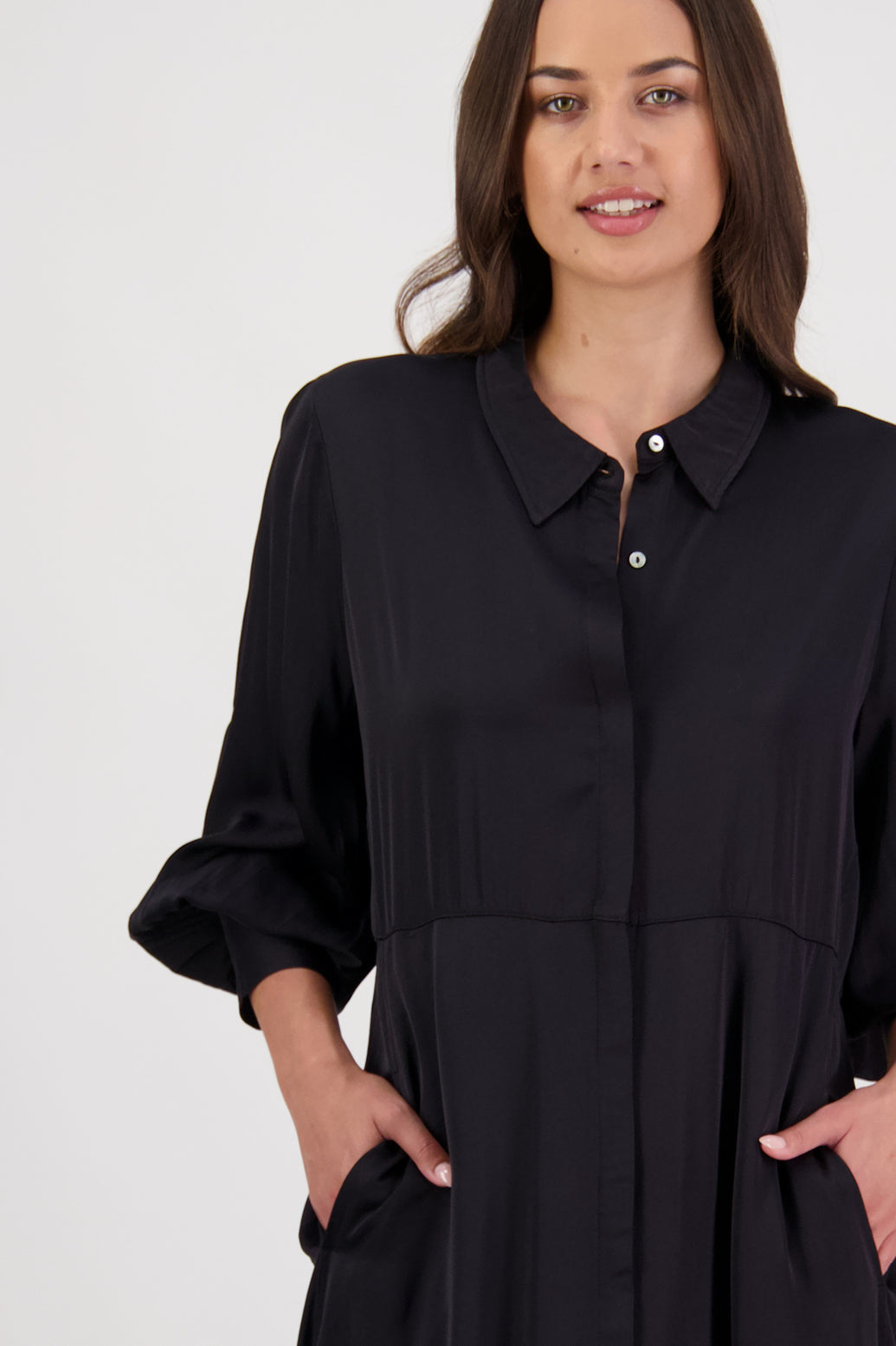Hollie Black Shirt Dress by Briarwood NZ. 100% Viscose shirt dress with long full length sleeves, fitted through the body, A-line skirt, Hidden button down front, extended cuff with 2 button closure