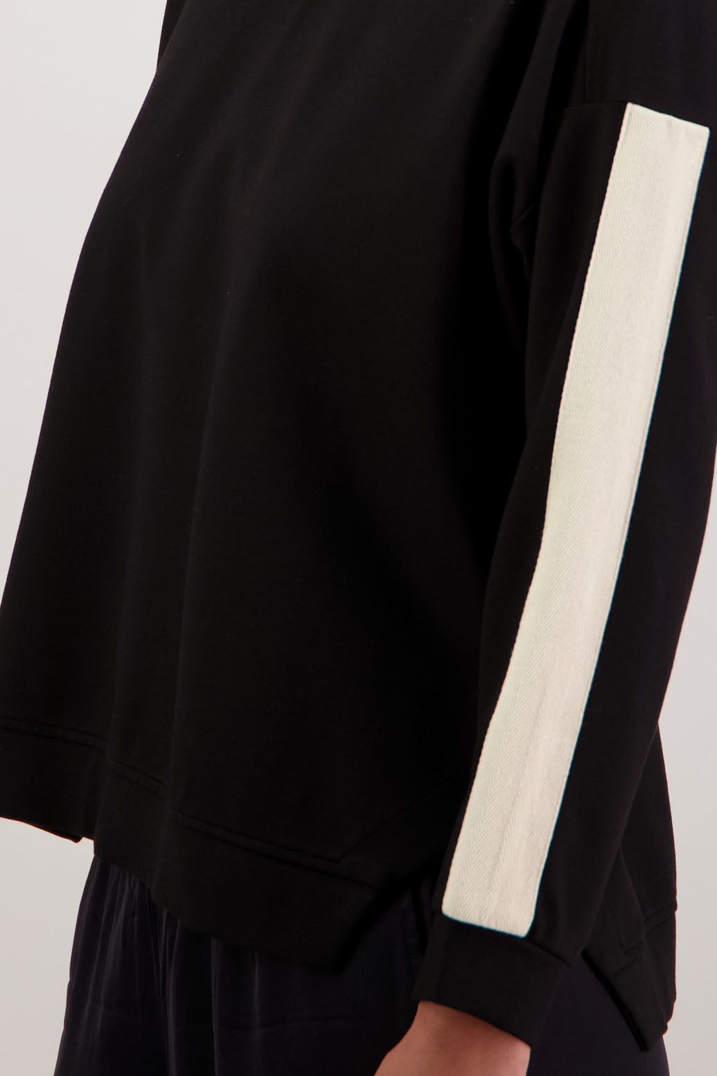 BESTSELLER. Holmes Sweatshirt in Black by Briarwood NZ. Ponte sweatshirt with full length sleeves, side split hem and contrast side stripe