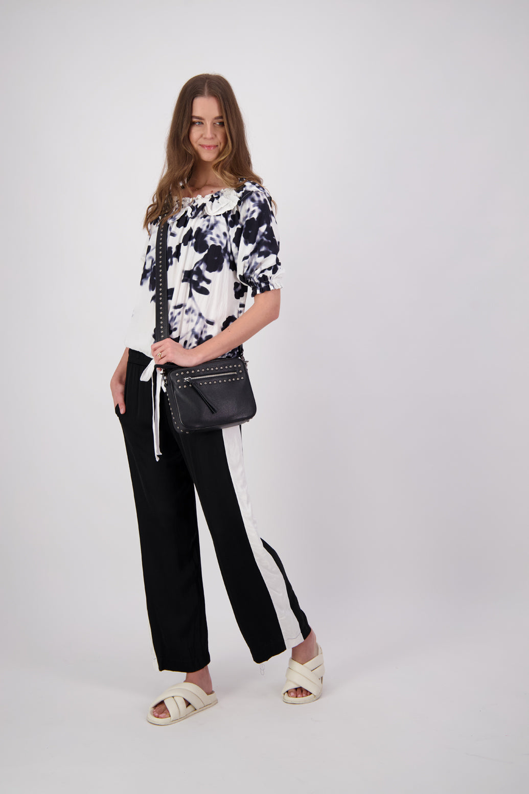 Black Briarwood wide leg pant with White/Ivory stripe down leg. Madi