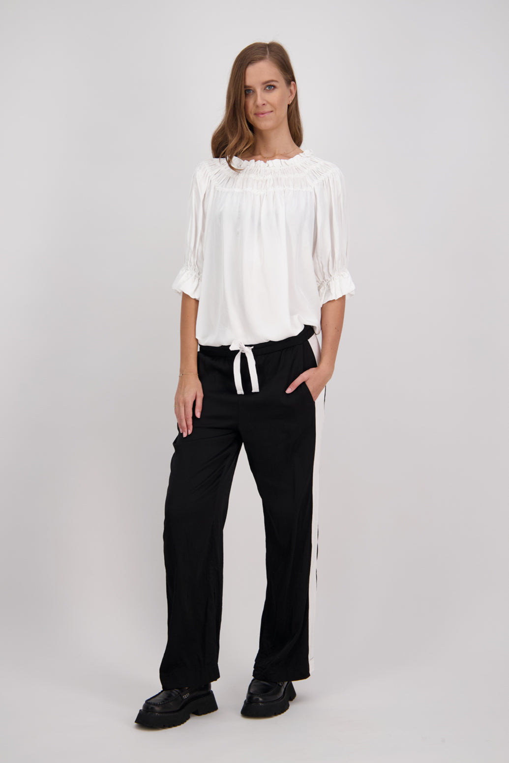 Black Briarwood wide leg pant with White/Ivory stripe down leg. Madi
