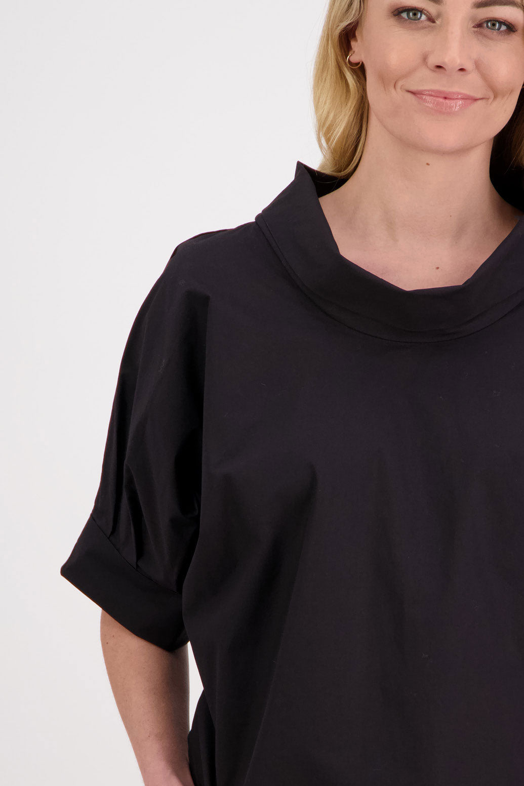 Padget short sleeve roll neck top with bat wing sleeves. Black, Cotton
