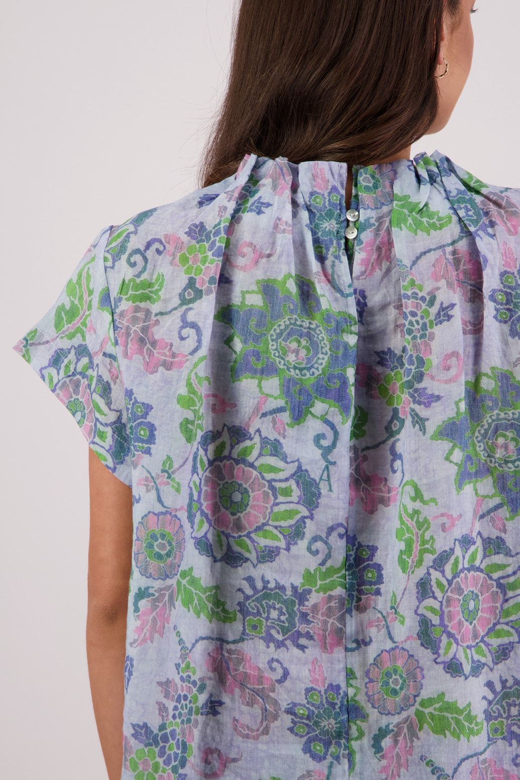 Close up of back view of Briarwood Pia Top in Blue Floral print.