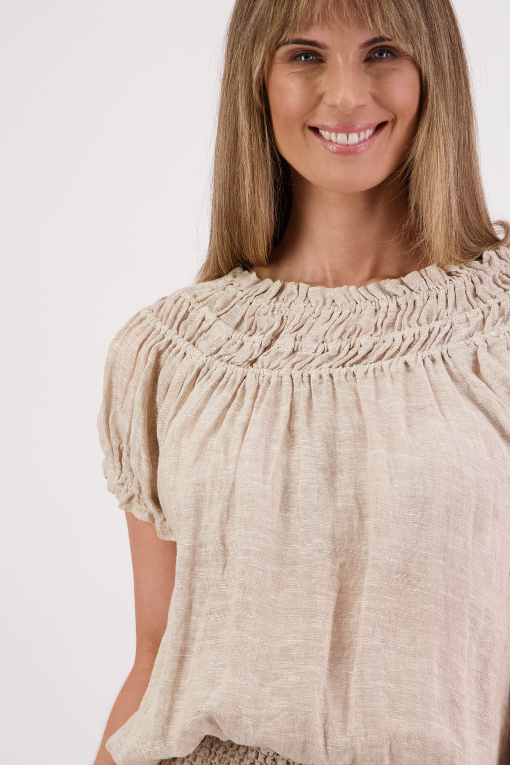 Womens short sleeve linen top with shirred neck and ruffle sleeve. Briarwood NZ. Polly, Natural