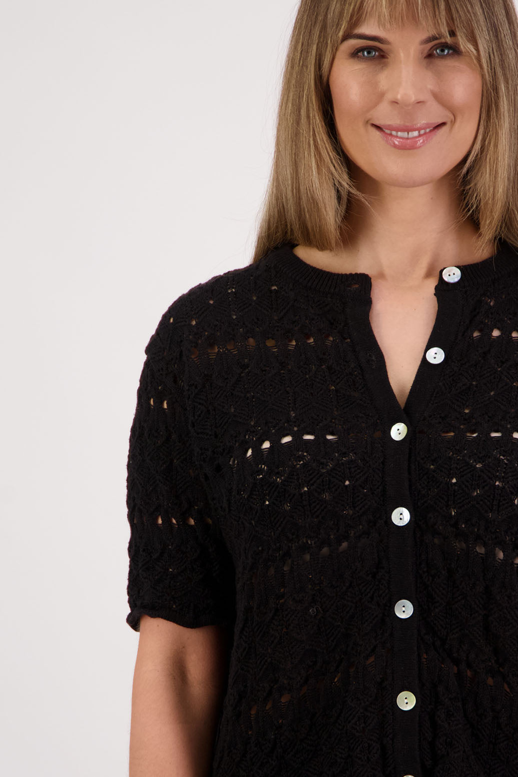 Womens knitted cotton lace short sleeve cardigan with shaped hem and scalloped edging. Briarwood NZ. Posy, Black