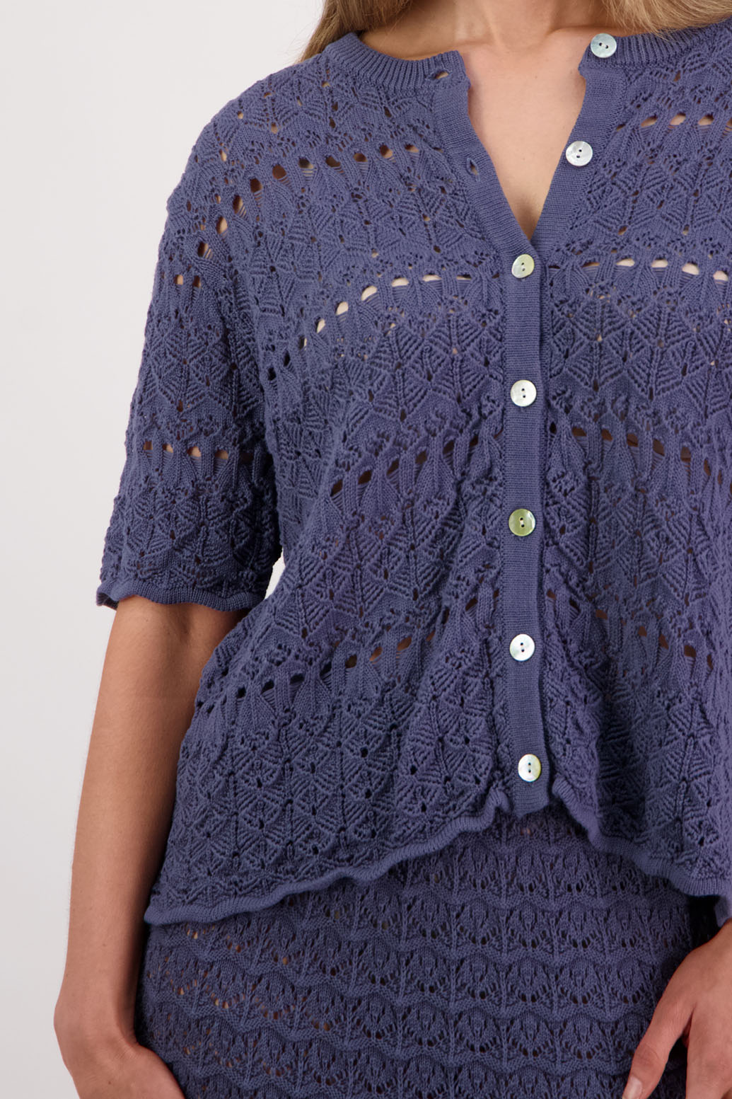 Womens knitted cotton lace short sleeve cardigan with shaped hem and scalloped edging. Briarwood NZ. Posy, Denim Blue