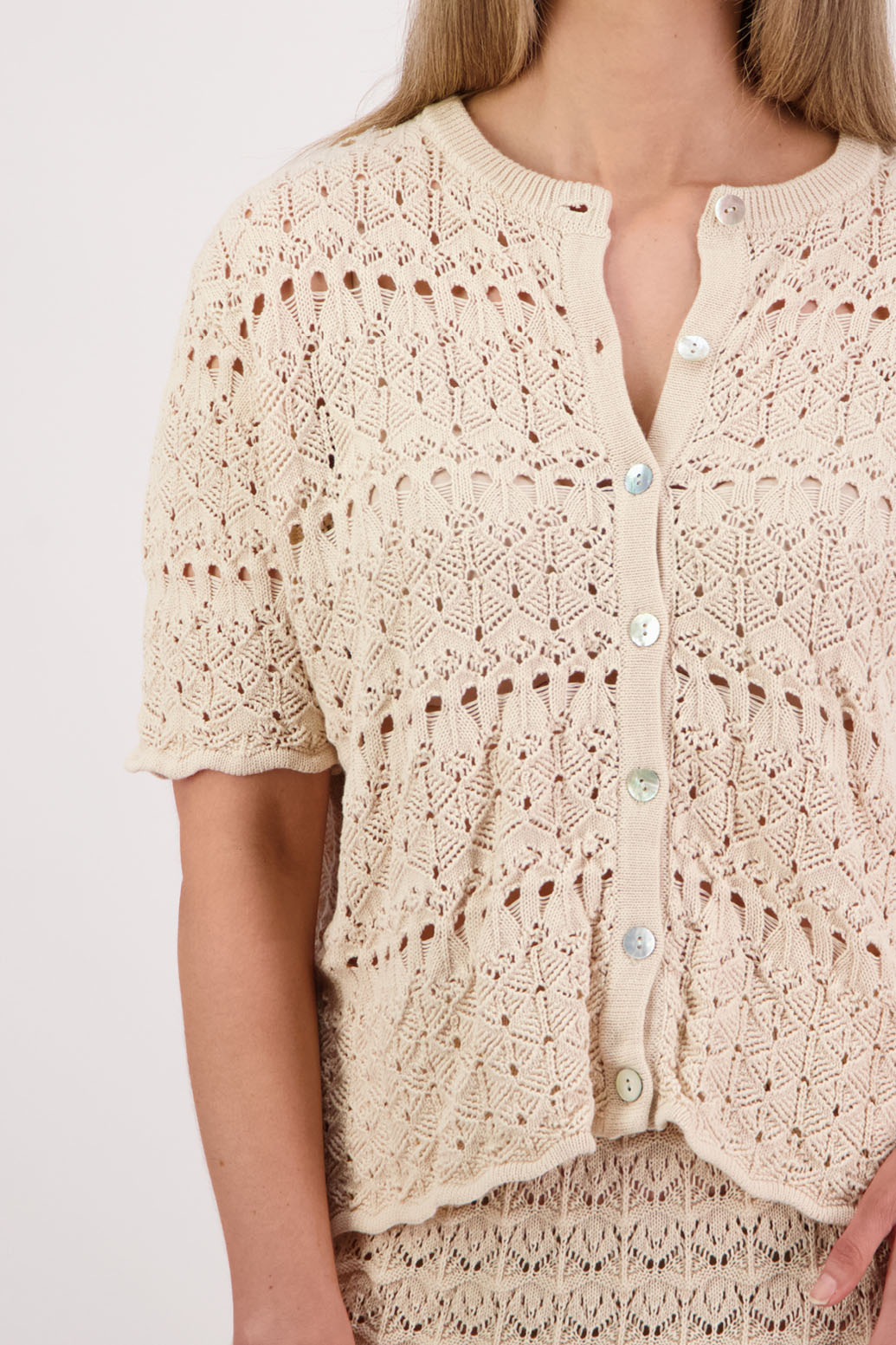 Womens knitted cotton lace short sleeve cardigan with shaped hem and scalloped edging. Briarwood NZ. Posy, Ivory