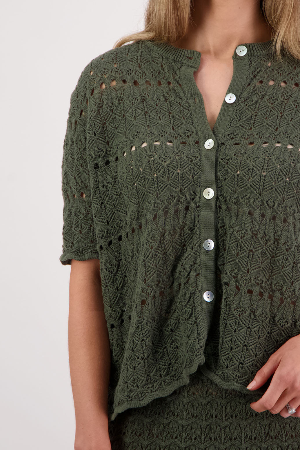 Womens knitted cotton lace short sleeve cardigan with shaped hem and scalloped edging. Briarwood NZ. Posy, Moss Green