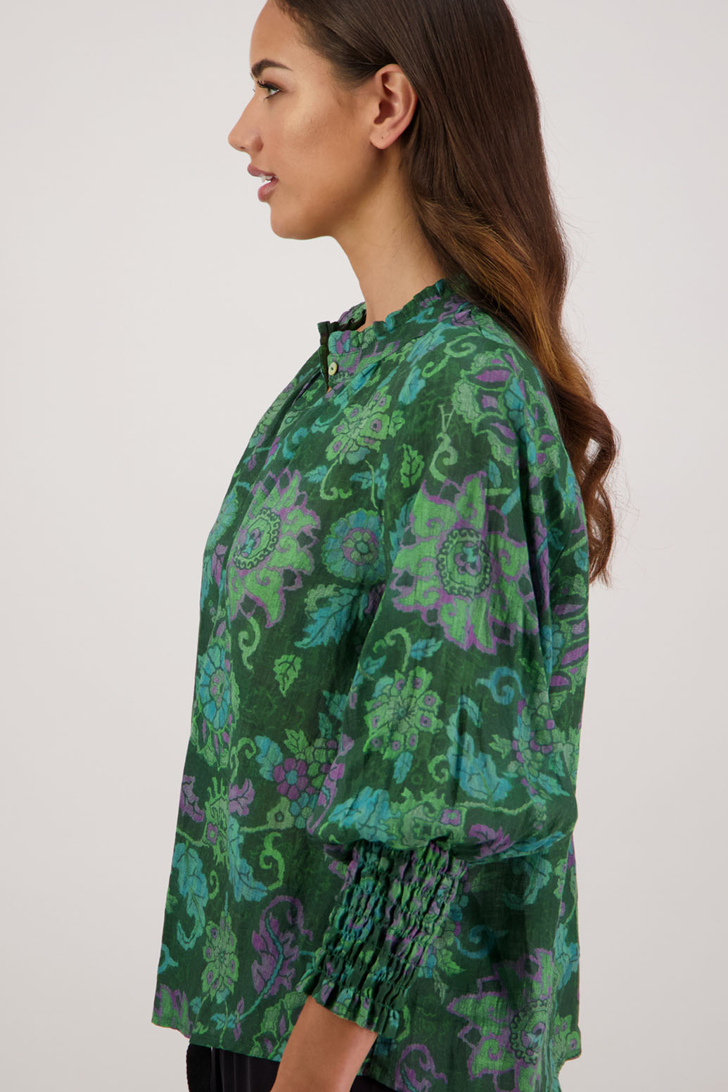 Raewyn Shirt in Green Floral by Briarwood NZ. 100% Ramie shirt with long sleeves, ruffle neckline, shirred waist and button front.