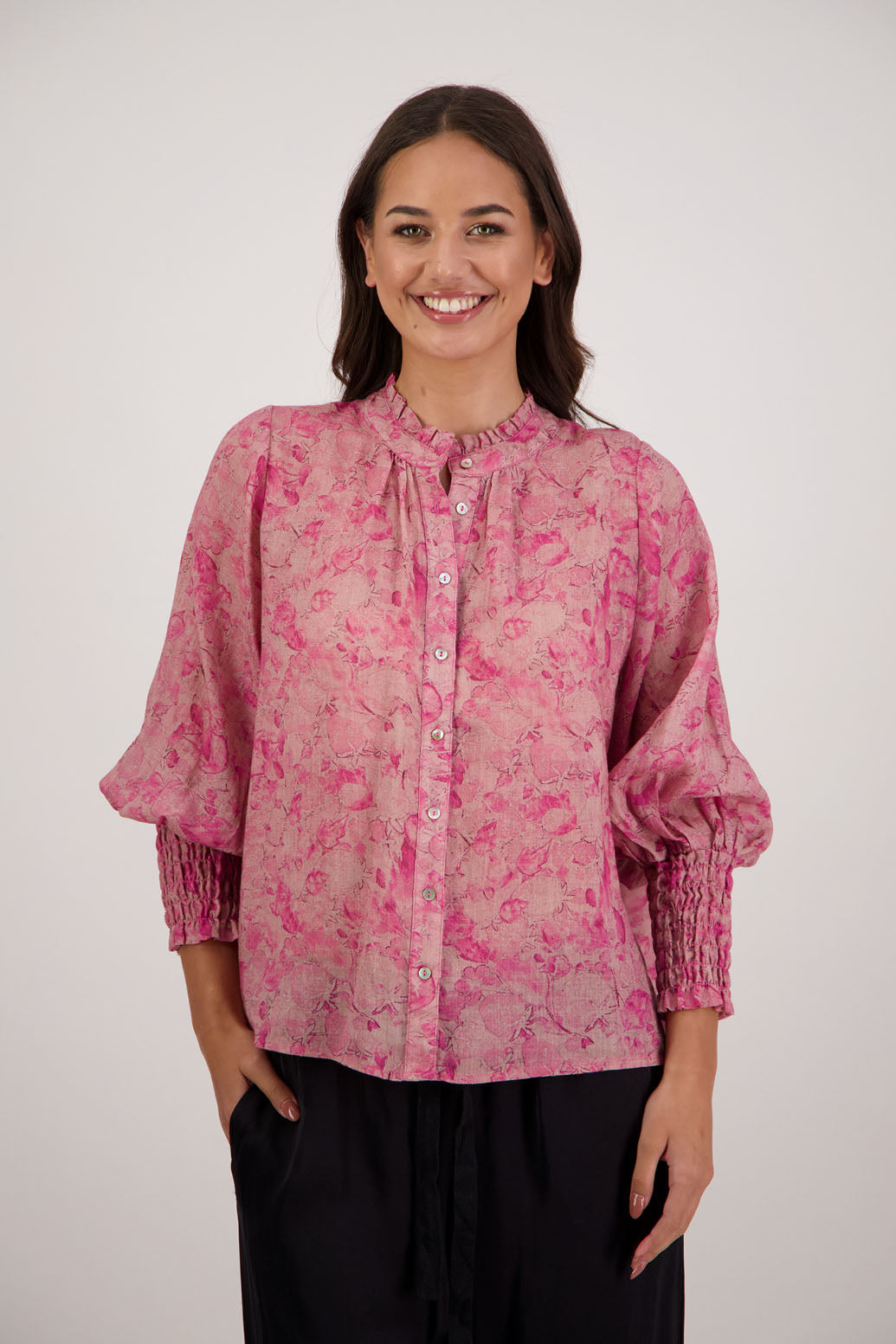 Raewyn Shirt in Pink Floral by Briarwood NZ. 100% Ramie shirt with long sleeves, ruffle neckline, shirred waist and button front.
