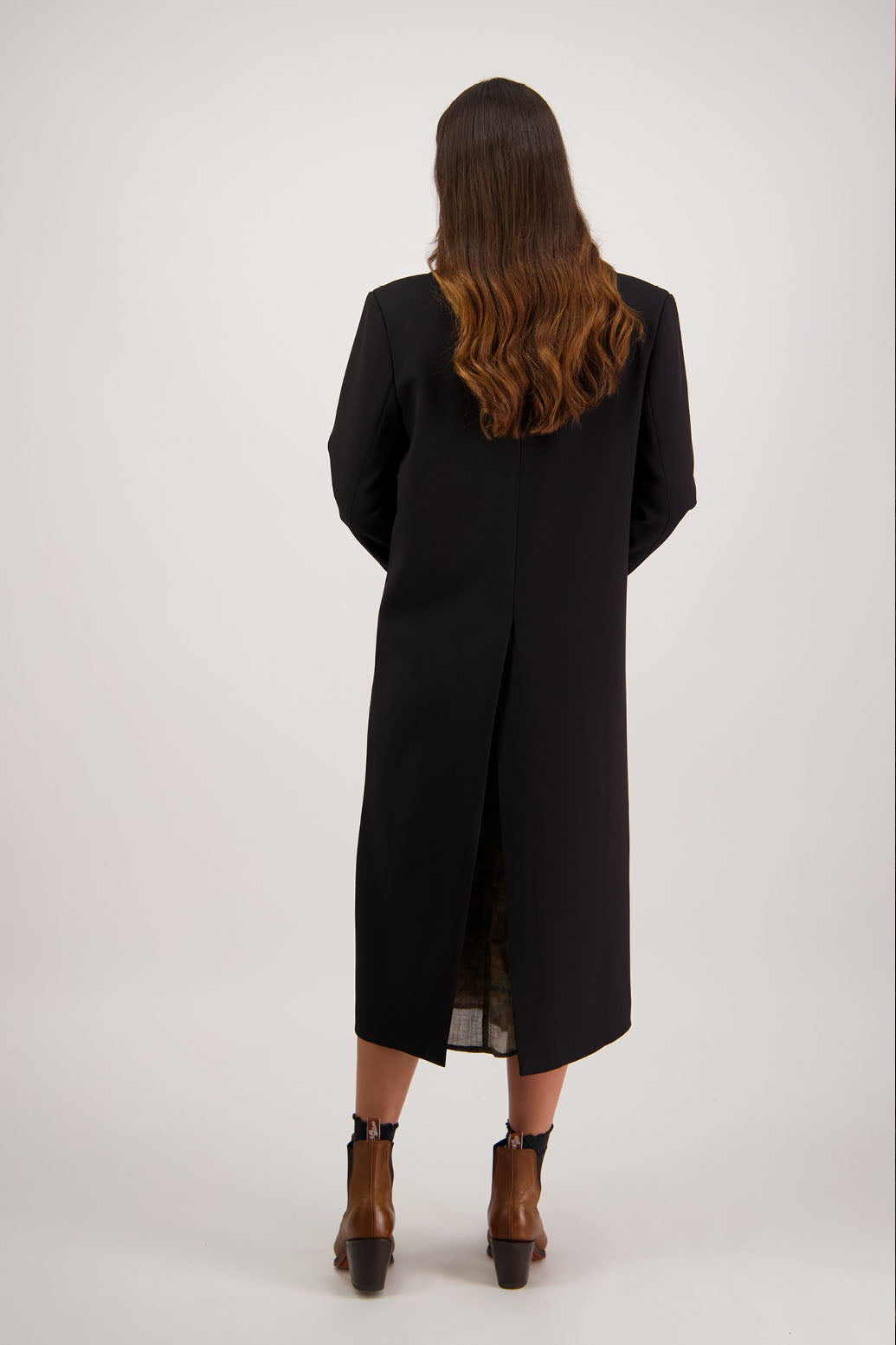 Ramsay Coat in Black by Briarwood NZ. A
blend of rayon, polyester and spandex tuxedo style coat with single button closure, flap pockets and high back split