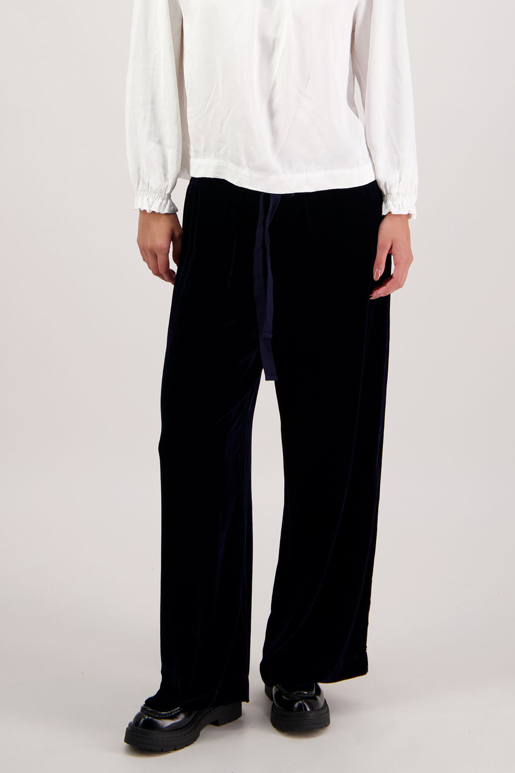 Reggie Pant in Ink Velvet by Briarwood NZ. A
18% Silk, 82% Rayon Velvet Pant with straight leg, elasticated waist with tie and pockets
