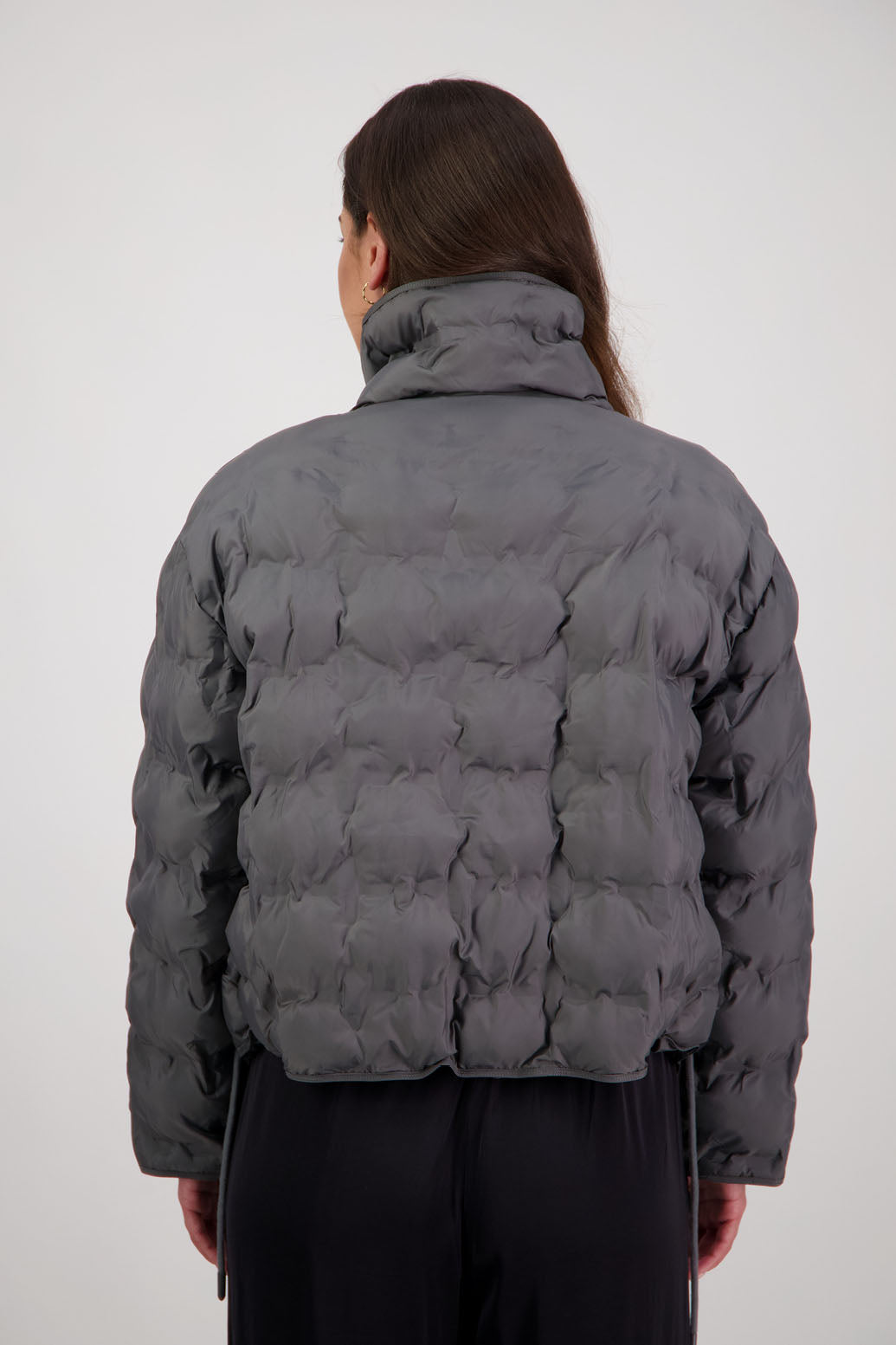 Rhodes Padded Jacket in Charcoal by Briarwood NZ. Features, magnetic dome closures, filled with plush fibres, elastic pull across the back with toggles to hold it in place, high collar with invisible magnetic closure, pockets