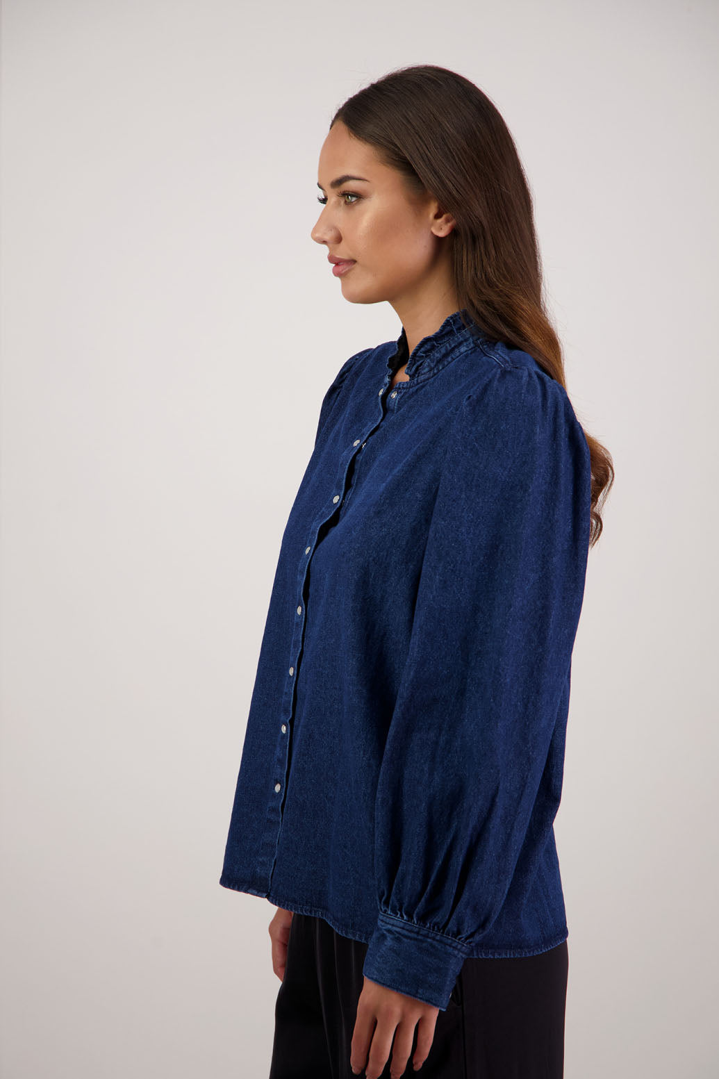 Ricci Denim Shirt by Briarwood NZ. 100% cotton shirt with full length sleeves, snap button closure, ruffles around neck