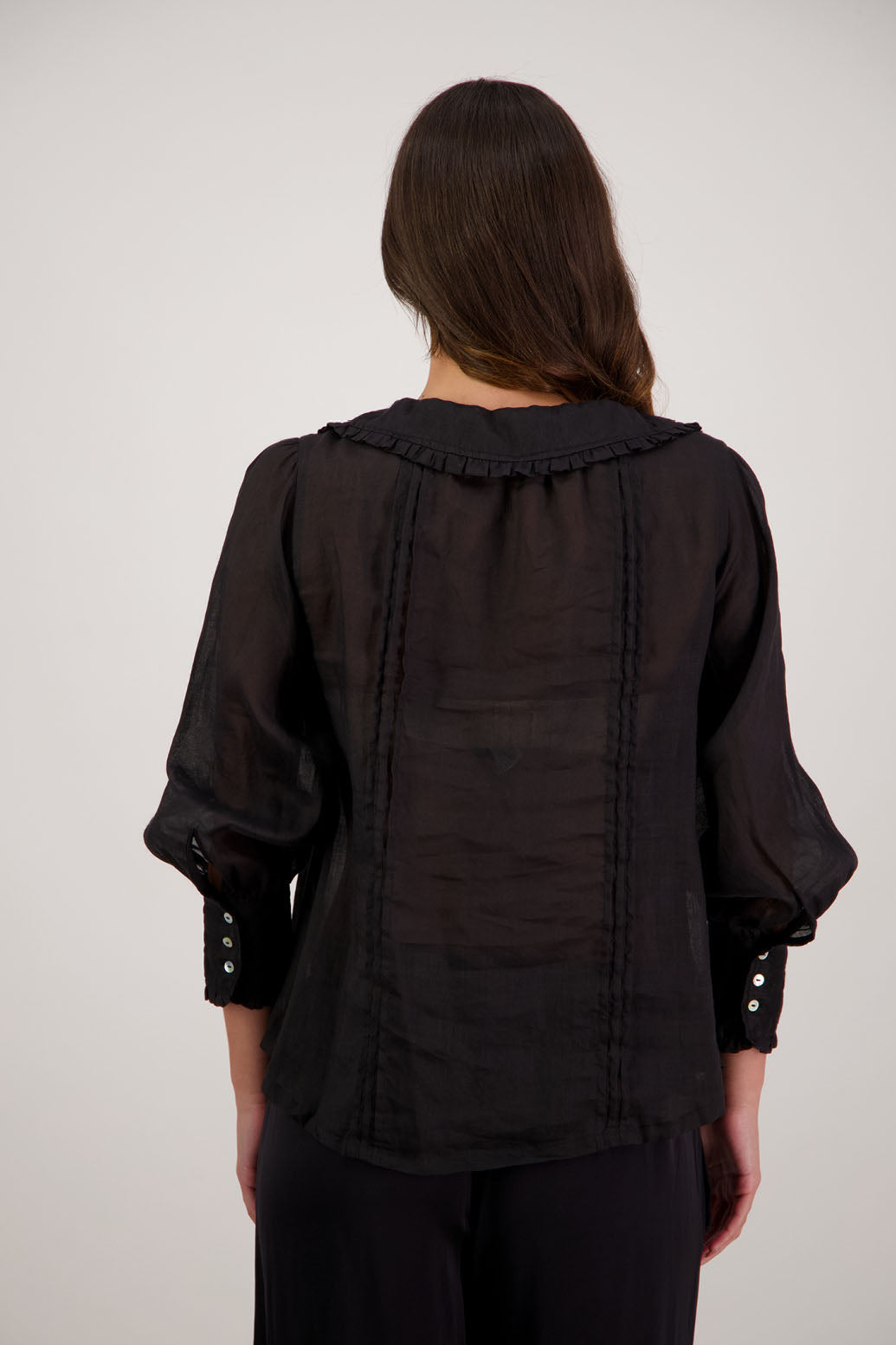 Richie Black Top by Briarwood NZ. 100% ramie top with shaped ruffle collar and tie detail. Designed in New Zealand.