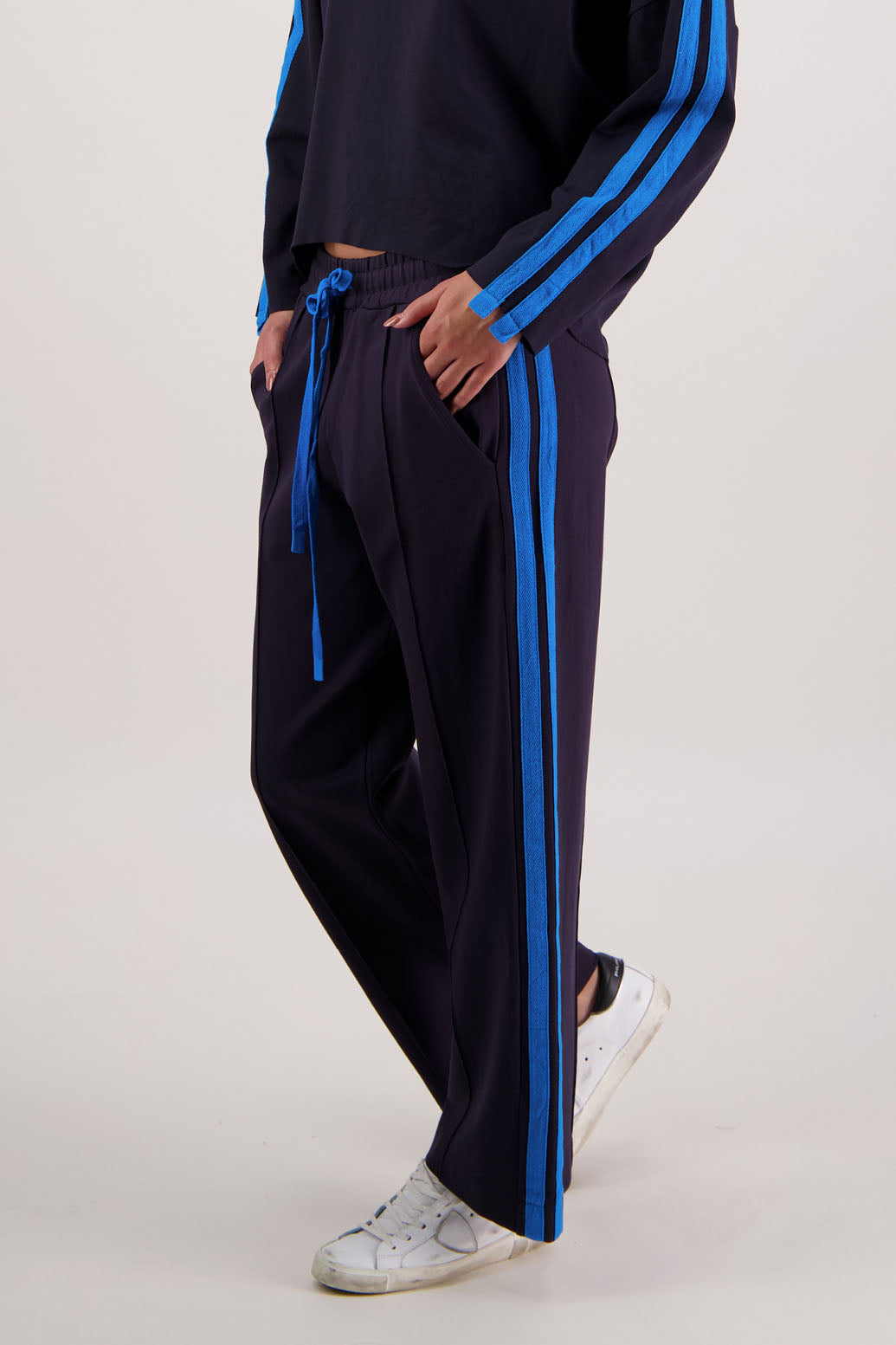 Rick Pant in Ink by Briarwood NZ. 100% Ponte pant with elasticated waist with draw cord, pin tuck front & back, double side stripe and pockets