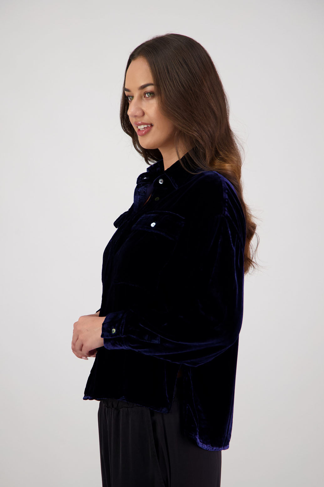 Ridge Shirt in Ink Velvet by Briarwood NZ. A
18% Silk, 82% Rayon Velvet collared button through shirt with full length sleeves, longer at the back, side splits, pockets on front