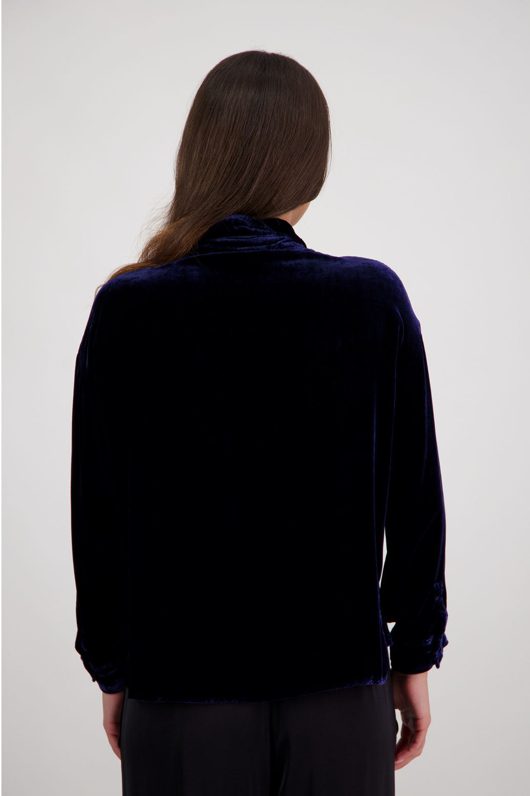 Ridge Shirt in Ink Velvet by Briarwood NZ. A
18% Silk, 82% Rayon Velvet collared button through shirt with full length sleeves, longer at the back, side splits, pockets on front