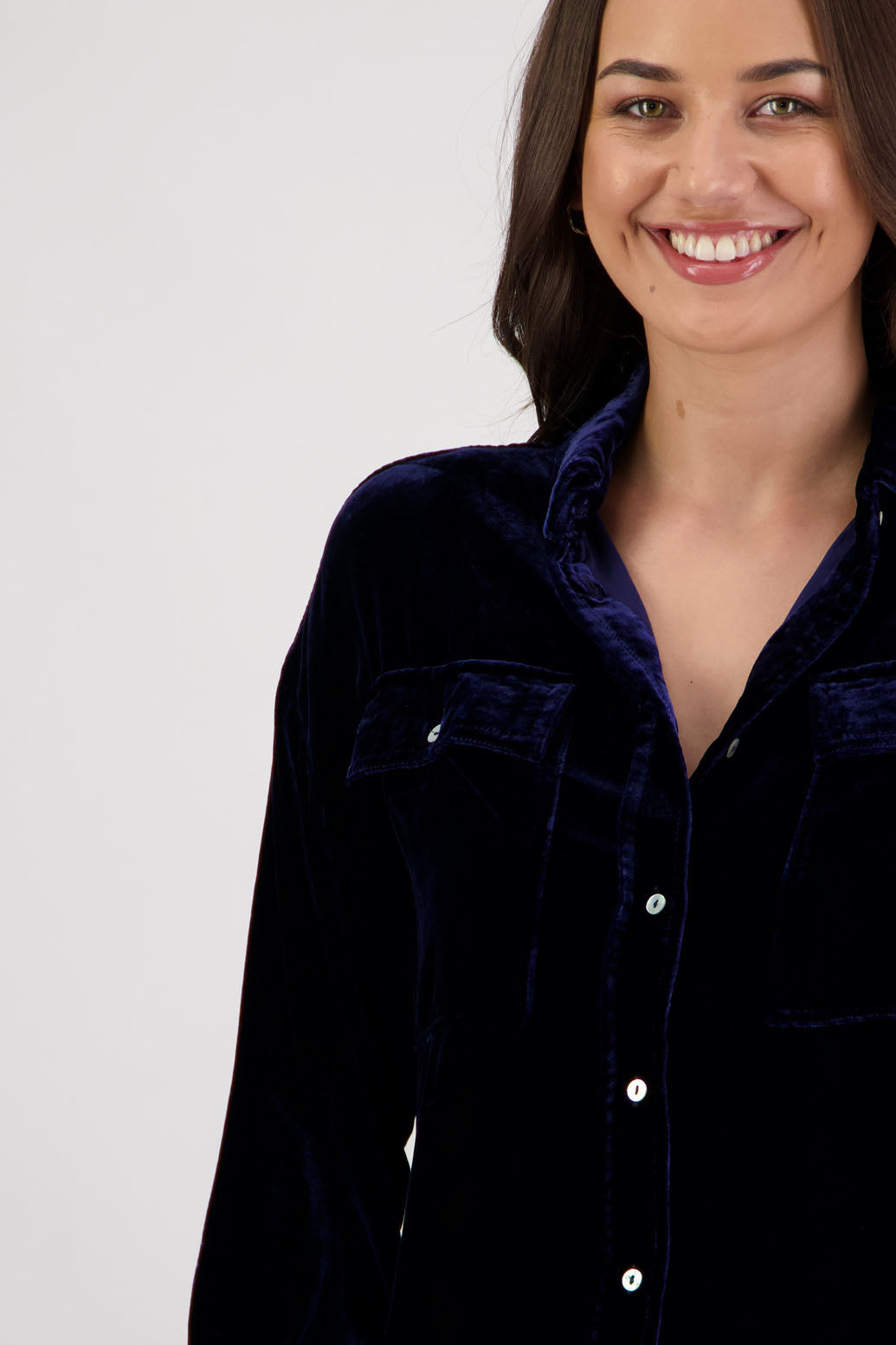 Ridge Shirt in Ink Velvet by Briarwood NZ. A
18% Silk, 82% Rayon Velvet collared button through shirt with full length sleeves, longer at the back, side splits, pockets on front