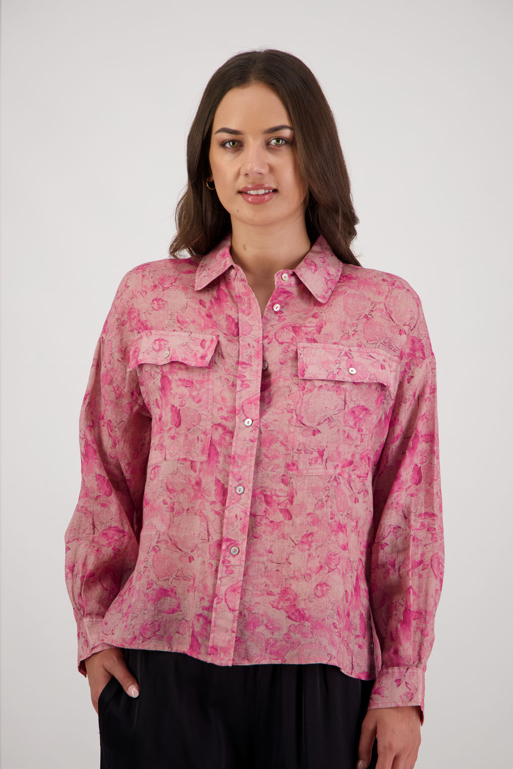 Ripley Shirt in Pink Floral by Briarwood NZ. 100% Ramie collared button through shirt, full length sleeves, longer at the back, side splits, pockets on the front