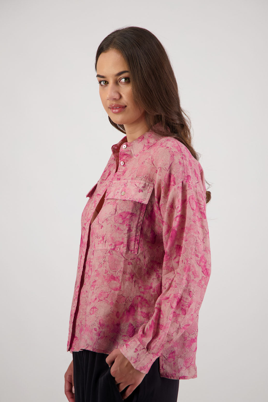 Ripley Shirt in Pink Floral by Briarwood NZ. 100% Ramie collared button through shirt, full length sleeves, longer at the back, side splits, pockets on the front