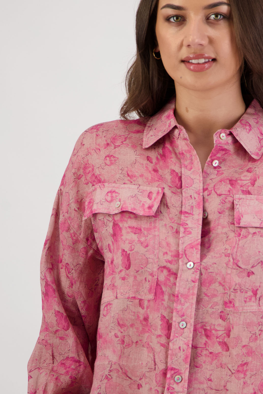 Ripley Shirt in Pink Floral by Briarwood NZ. 100% Ramie collared button through shirt, full length sleeves, longer at the back, side splits, pockets on the front