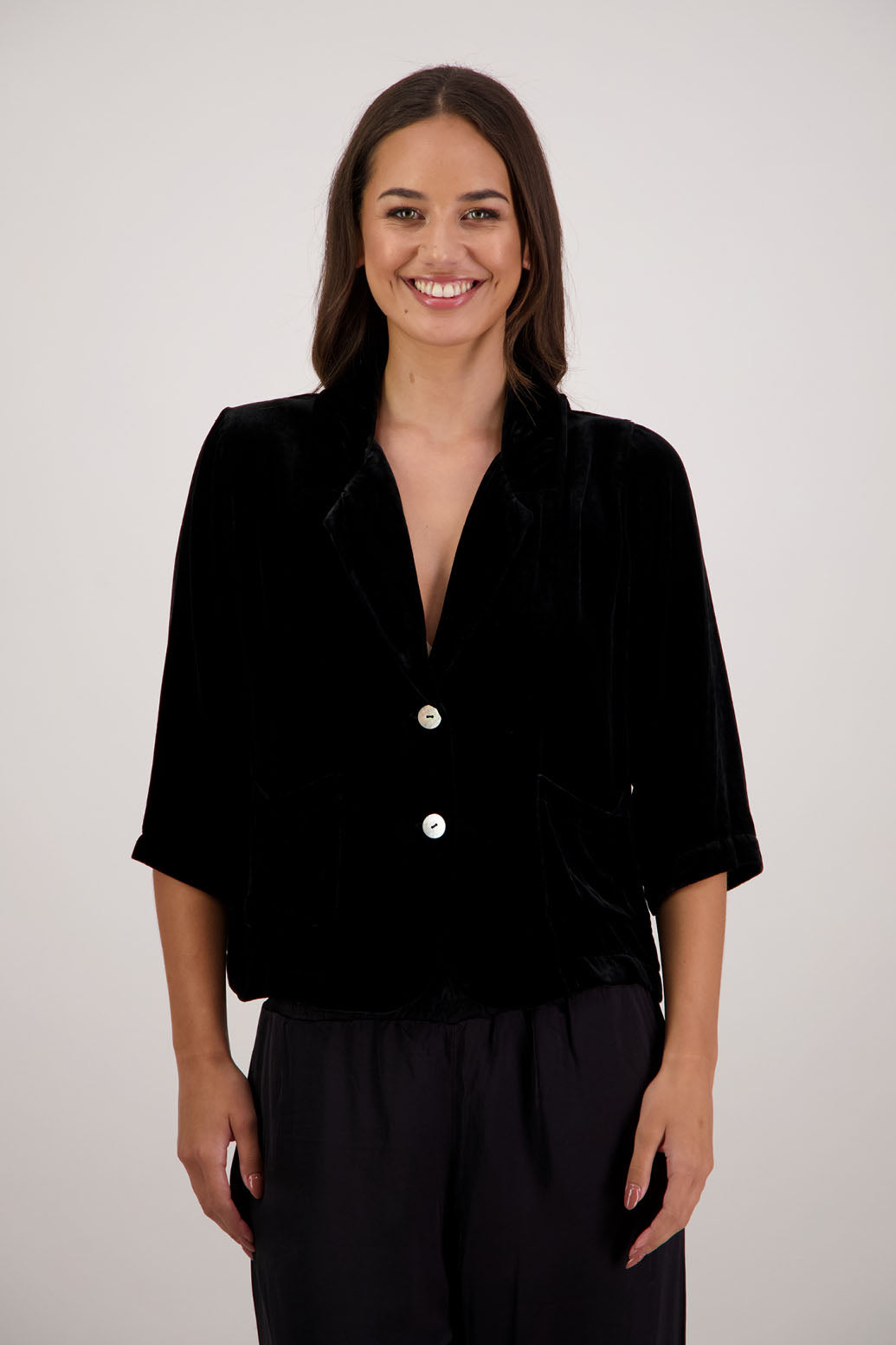 Rita Jacket in Black Velvet by Briarwood NZ. A
18% Silk, 82% Rayon Velvet Jacket with 3/4 length sleeves, soft collar, double button closure, soft pockets, back split